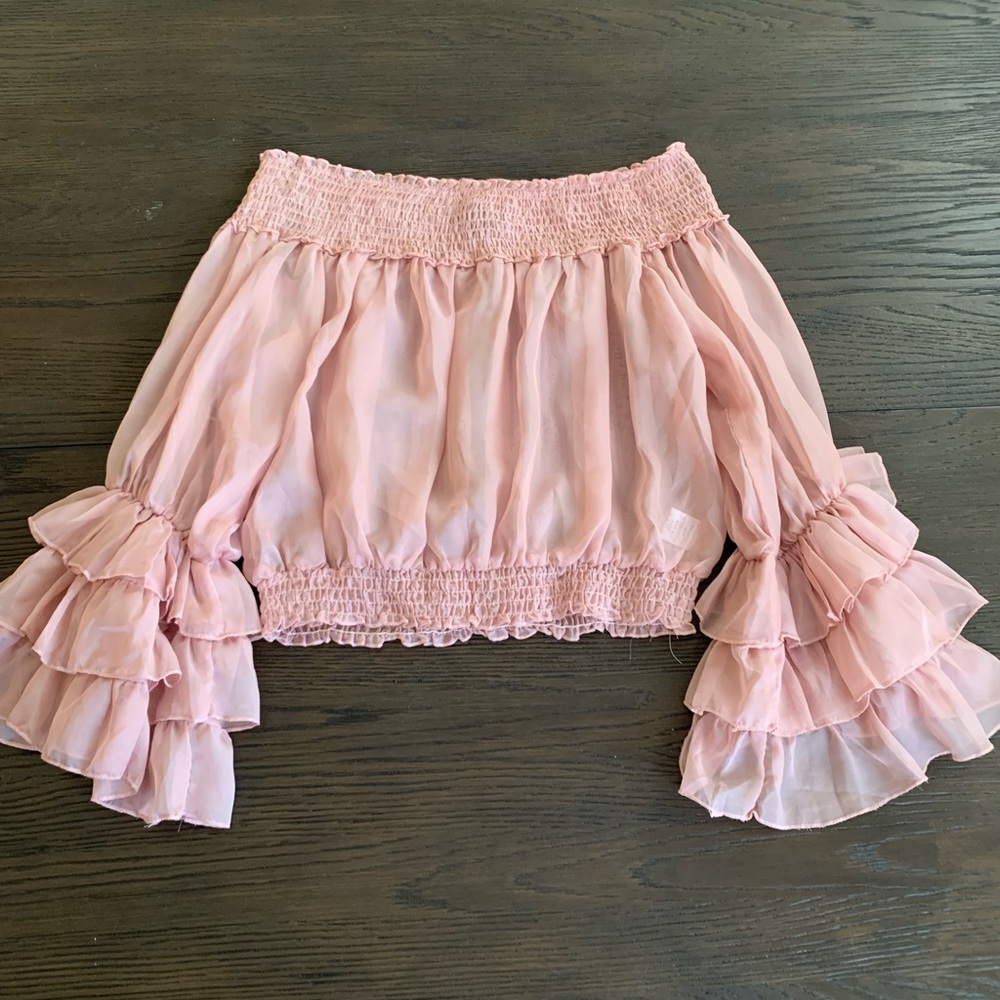 pink ruffled shirt